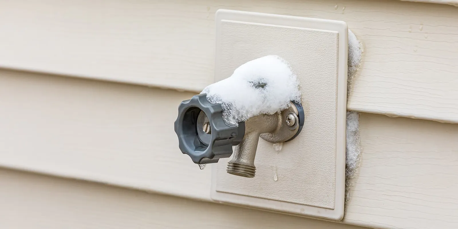 Insulated outdoor faucet protected from freezing during a Chesterfield winter