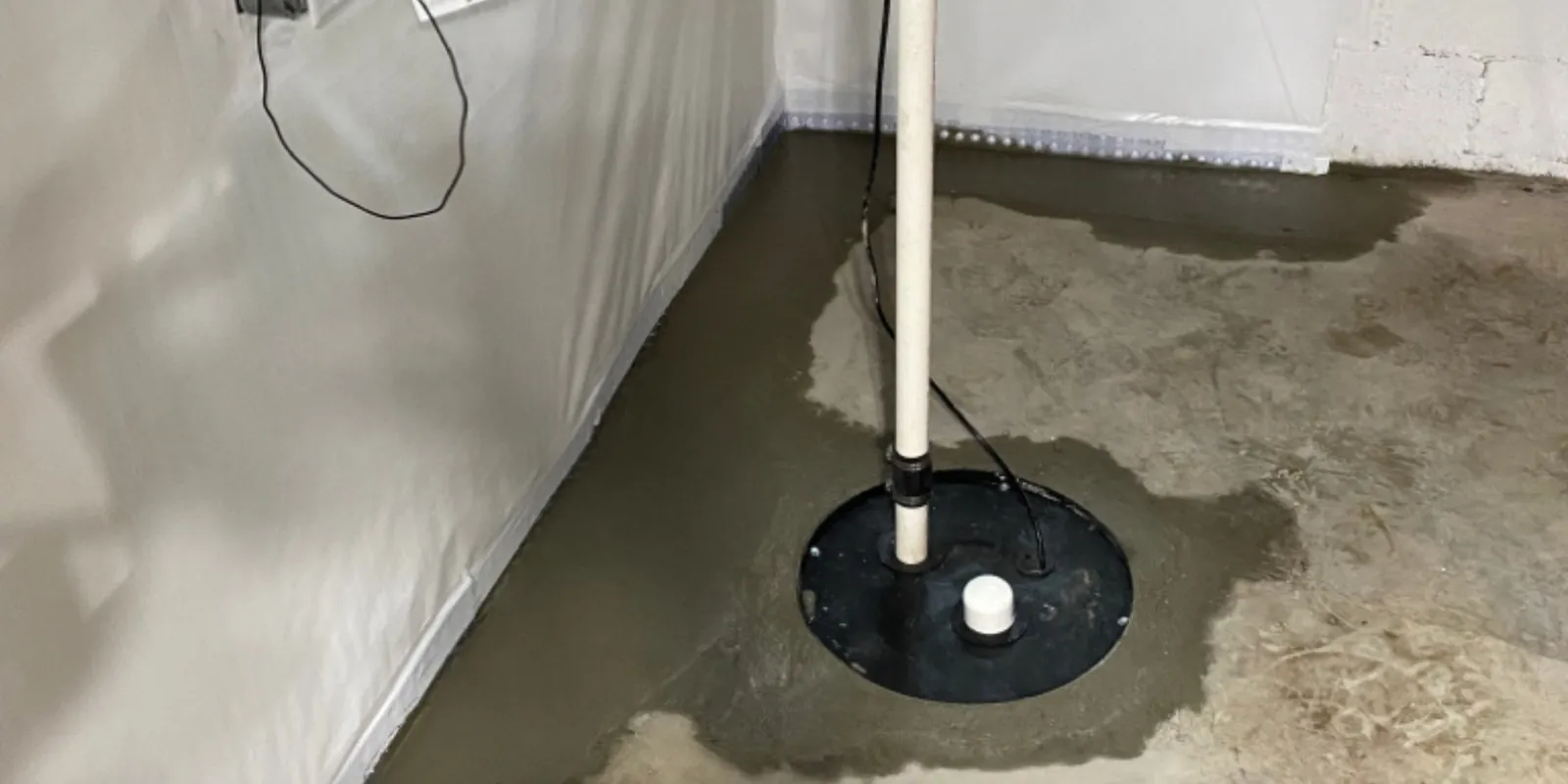 Plumber performing sump pump repair for a Chesterfield area home