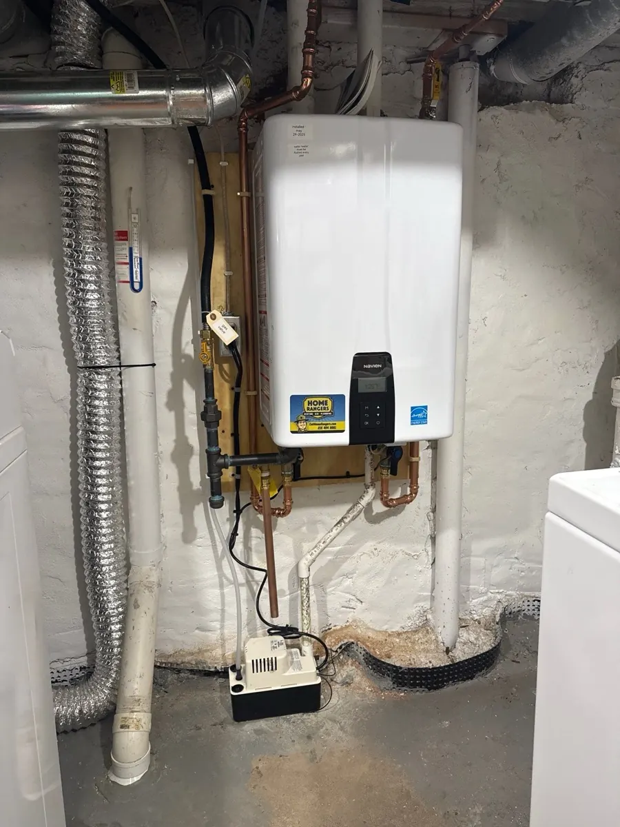 Wall mounted tankless water heater with venting